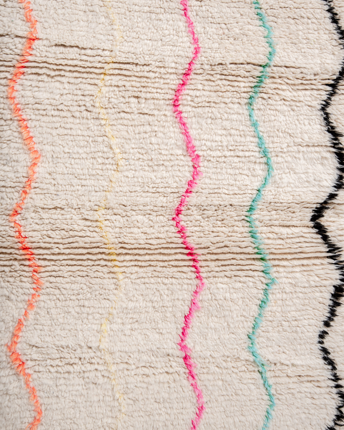 Modern, designer, handcrafted Berber rug from Morocco. Beniourain carpet with beautiful colours and patterns and fluffy wool texture.